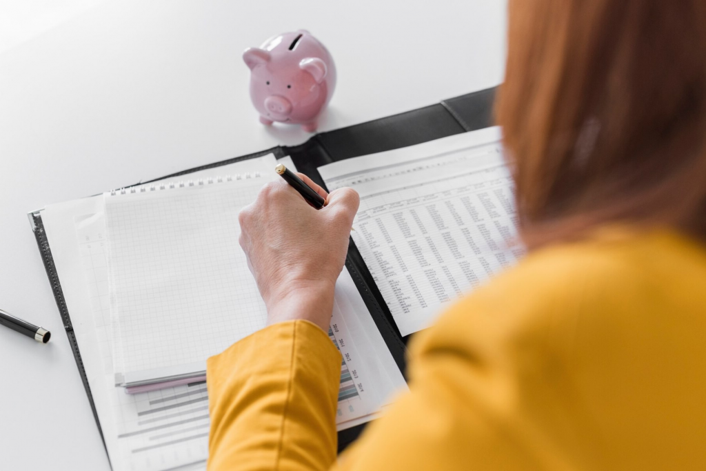 woman doing monthly budgeting-savings accounts