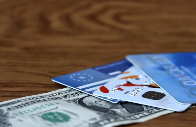 $1 bill and credit cards on top close up