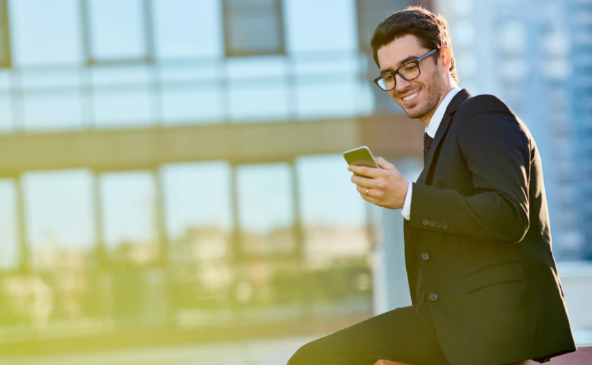 portrait of a business men using his smartphone