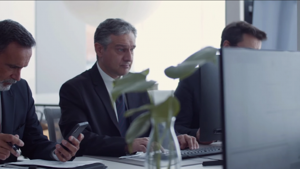 Men sitting in an office working